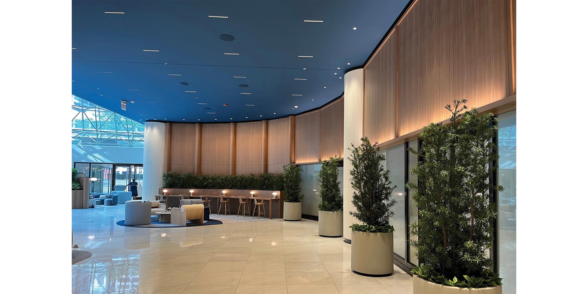Recessed linear lighting and downlighting in the lobby ceiling at 525 W. Monroe